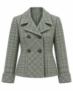 Front view of women's teal checked tweed jacket featuring classic double-breasted tailoring. Back view of women's teal country tweed jacket showing its structured hip-length silhouette. Side view of women's blue-green checked tweed jacket featuring elegant turn-back cuffs. Close-up of teal tweed fabric featuring beige, grey, and subtle brown heritage checks. Detail of women's double-breasted tweed jacket showing four dark buttons and a wide fold-over collar.
