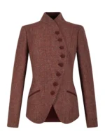 Front view of women's rust red tweed blazer featuring a distinctive stand collar and fabric-covered buttons. Back view of women's rust tweed blazer showing its fitted waist and structured feminine silhouette. Side view of women's terracotta tweed blazer featuring elegant tailoring and curved front hem. Close-up of rust red tweed fabric showing fine burgundy, copper, and earthy brown textured detailing. Detail of women's rust red stand collar tweed blazer showing covered-button fastening and contrasting welt pocket accents.
