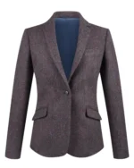 Front view of women's plum tweed blazer featuring elegant notch lapels and structured tailoring. Back view of women's plum tweed blazer showing its fitted waist and hip-length silhouette. Side view of women's muted purple tweed blazer featuring traditional tailored shoulders. Close-up of plum tweed fabric featuring an intricate herringbone-inspired textured pattern. Detail of women's plum tweed blazer showing notch lapels, traditional flap pockets, and button-detailed cuffs.